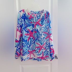 Woman’s Lilly Pulitzer Starfish silk blouse with 3 Lilly buttons on front.